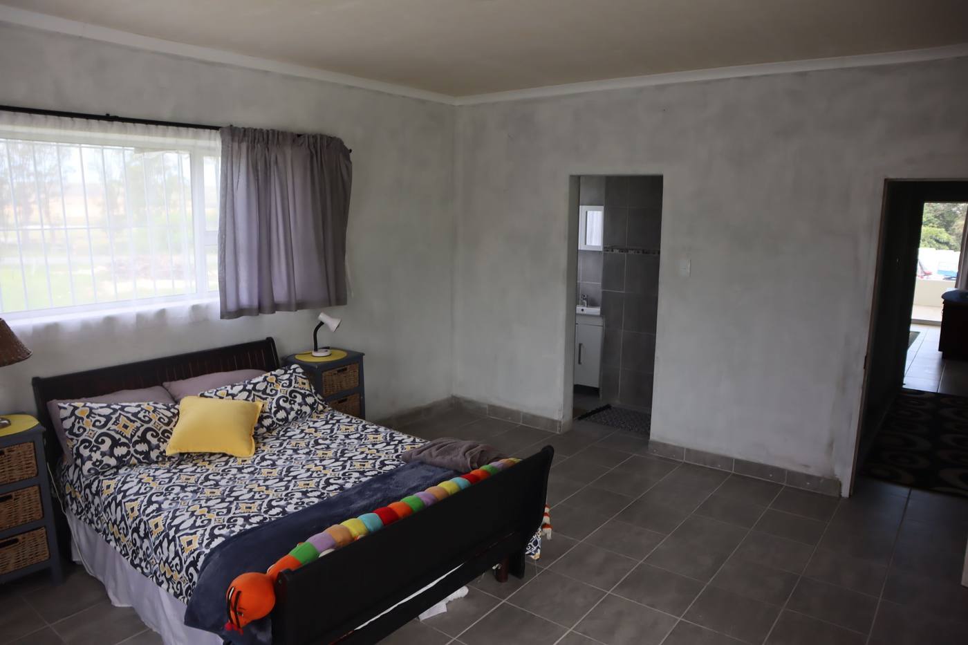 The same bedroom, with the door through to its own bathroom