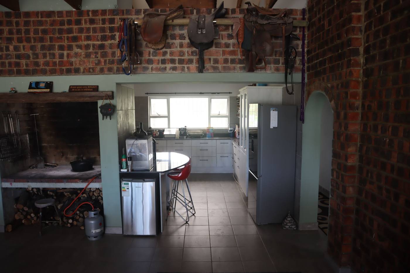 The indoor braai with its wood store, opening straight into the kitchen