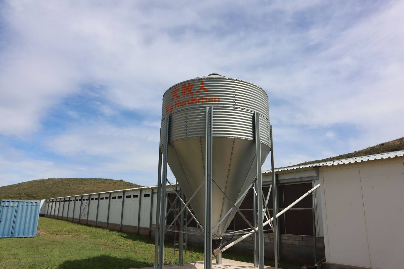 A feed silo beside the layer house